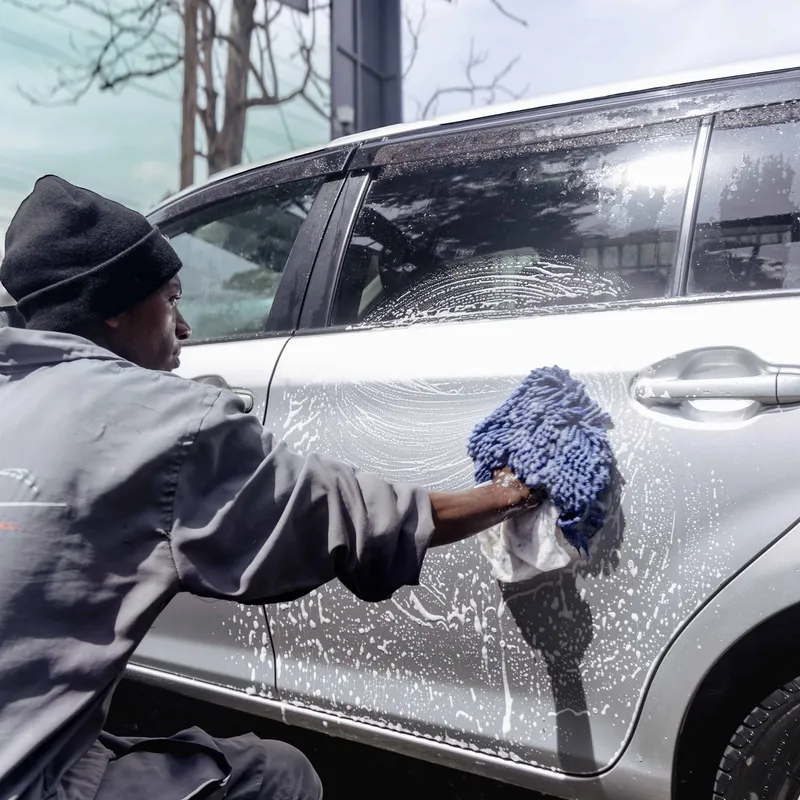 Buffing and paint correction service on a polished vehicle